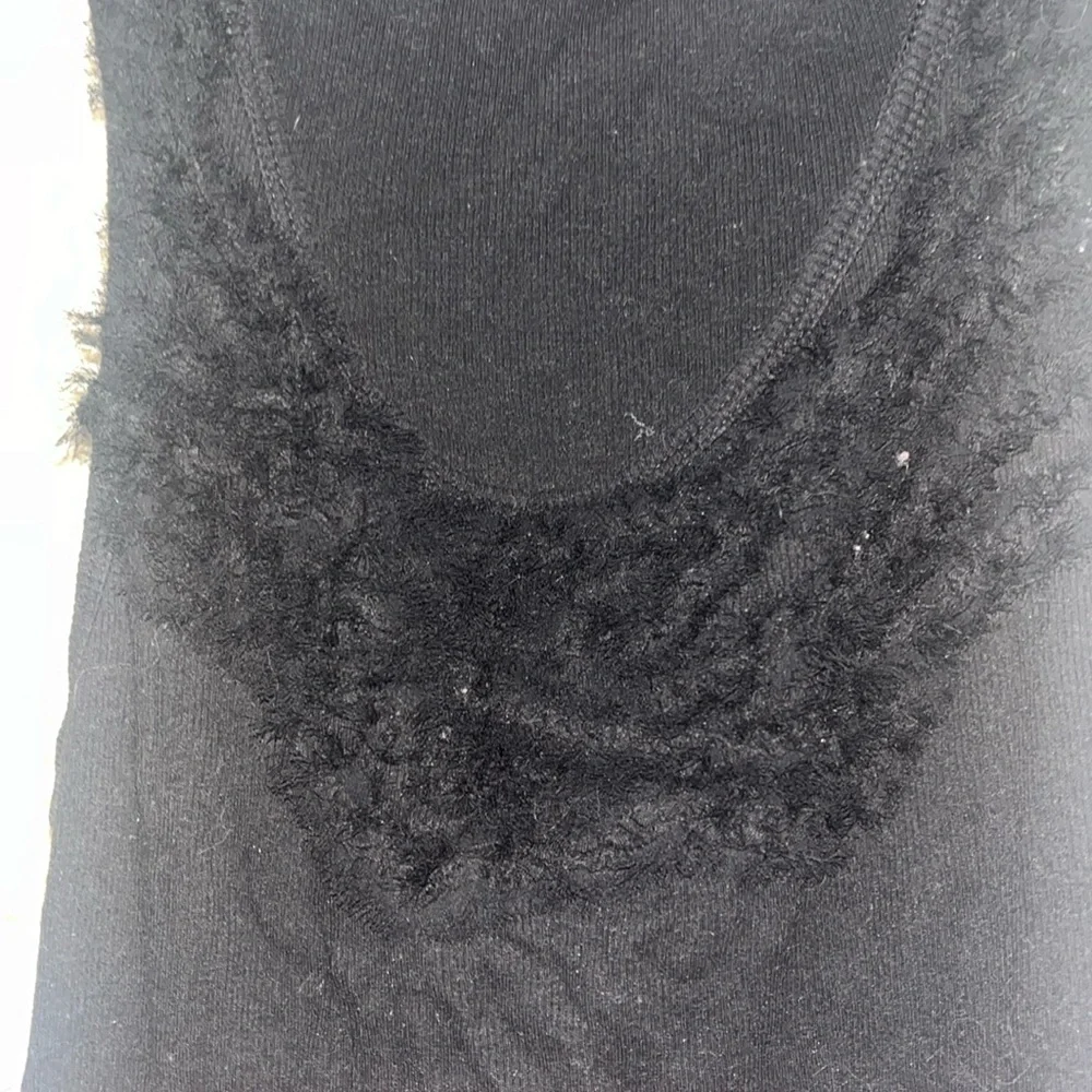 elle ruffled black tank top